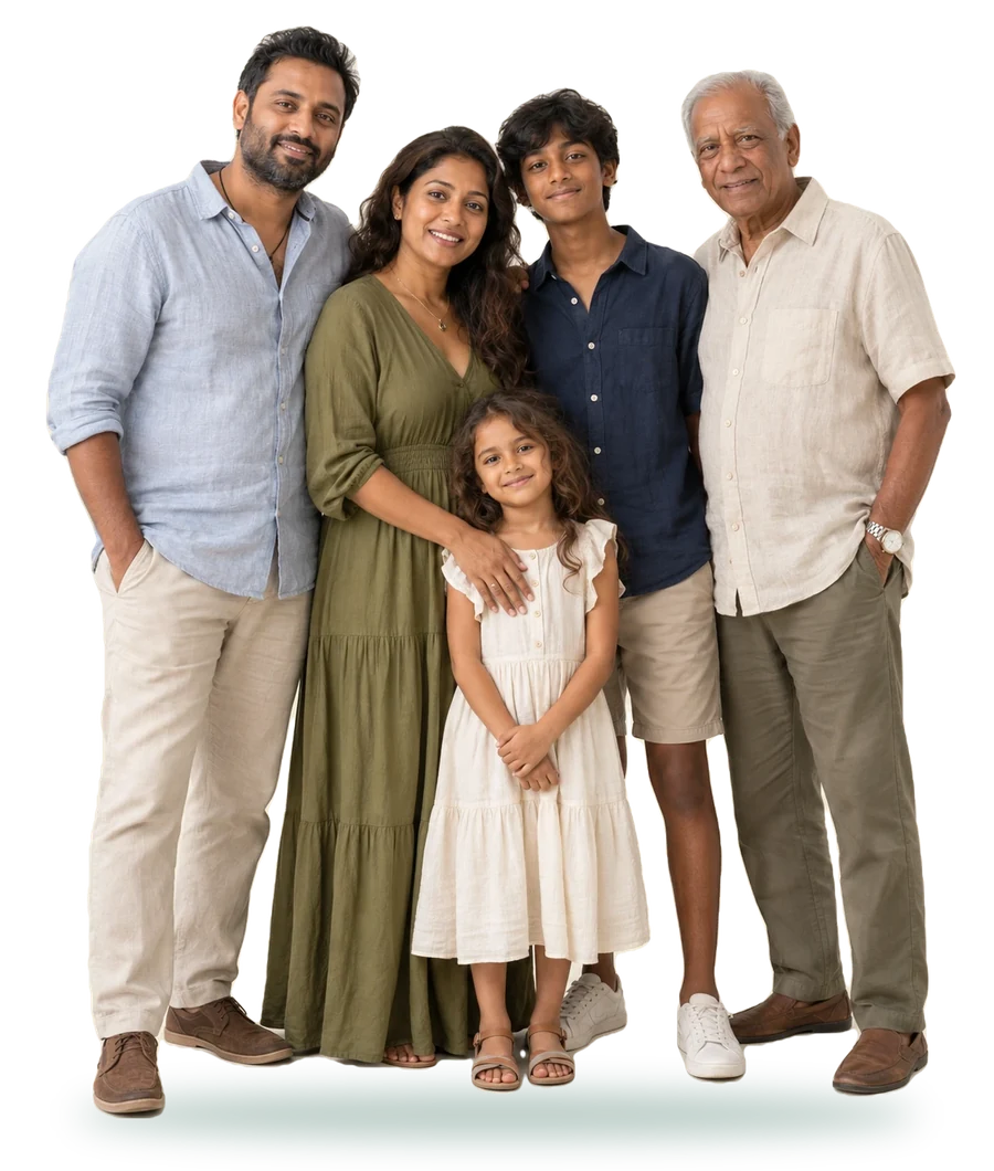 A Sri Lankan family of five standing together: a father, a mother, a teenage son, a young daughter and a grandfather, smiling
